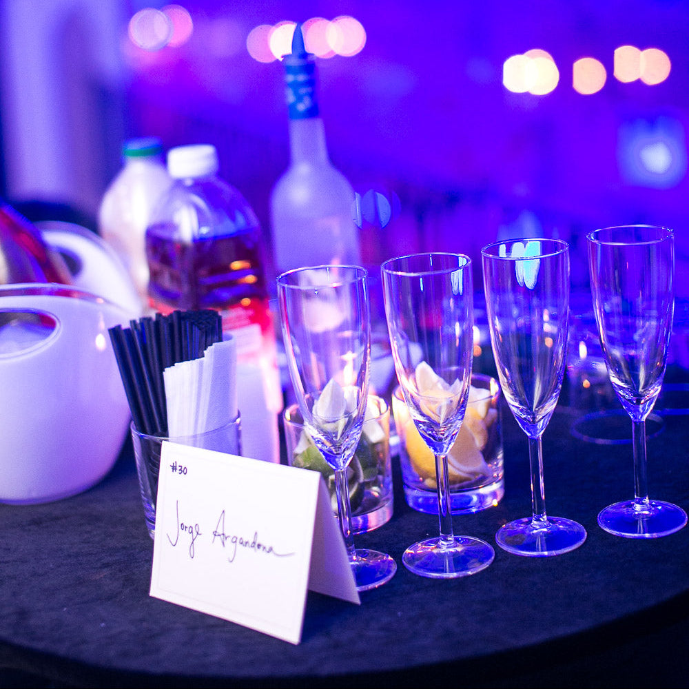 VIP table setup with champagne glasses and spirits at Final Fantasy New Year’s Eve party in Montreal